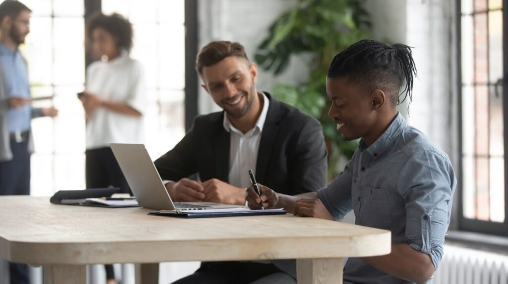 stock-photo-satisfied-african-american-customer-signing-contract-at-meeting-with-manager-making-great-deal-1746124484-transformed